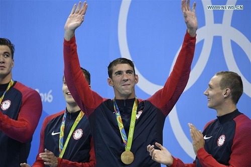 Phelps with hands raised