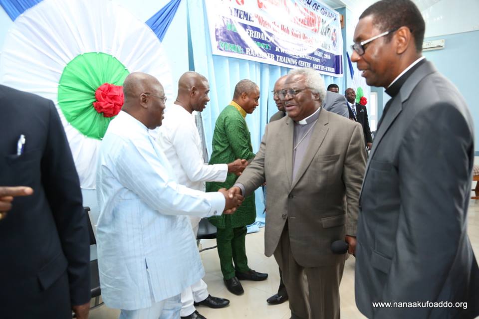 Rev. Martey in a handshake with Nana Akufo-Addo (in white attire)