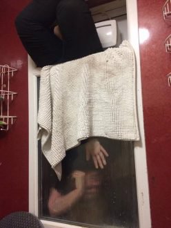 Woman tries to retrieve poo, gets stuck in window