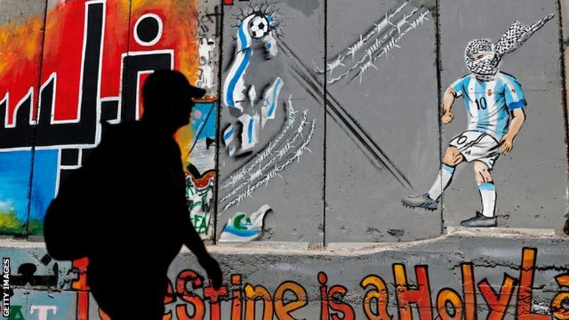 Lionel Messi was featured in a mural painting on Israel's separation barrier in the occupied West Bank city of Bethlehem, kicking a ball which destroys the Israeli flag