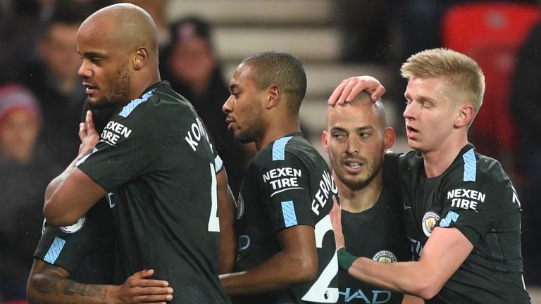 David Silva (centre) is congratulated by his Man City team-mates after opening the scoring against Stoke 
