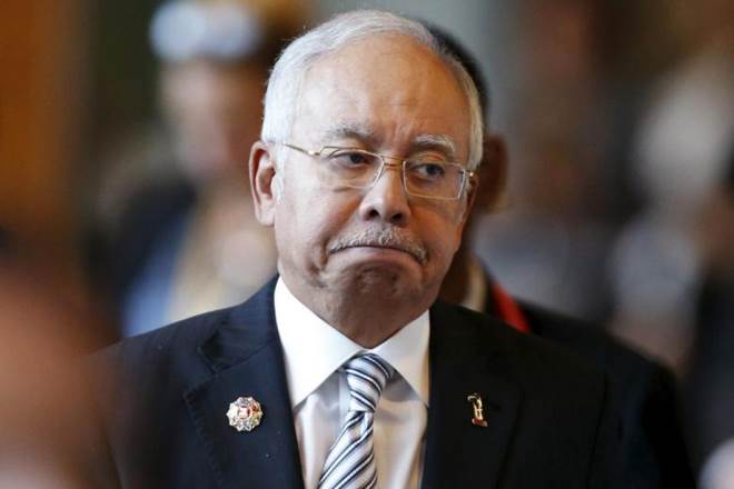 Former Malaysia Prime Minister banned from leaving country