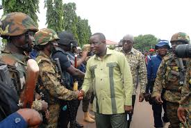 Dominc  Nitiwul, Defence Minister, and Ambrose Dery, Interior Minister in a hand shake with the ‘Operation Vanguard’ during the inauguration