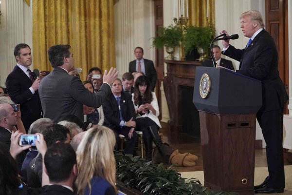 US President Donald Trump points to journalist Jim Acosta(centre) from CNN during a post-election press conference in the East Room of the White House in Washington, DC on November 7, 2018. PHOTO | MANDEL NGAN | AFP
