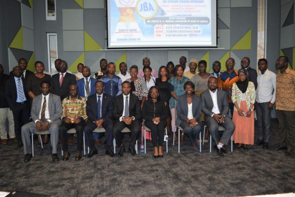 Participants with officials of the BoG and Ecobank Ghana at the workshop 