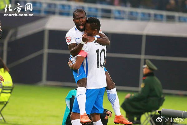 Frank Acheampong jubilates with Mikel Obi