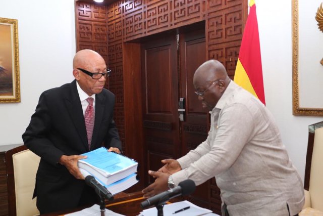 Justice Emile Short presenting the report to the President