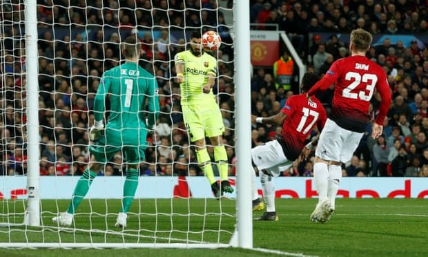 Luis Suárez heads the ball across goal – it would strike Luke Shaw on the shoulder and go in at the back post. Photograph: Andrew Yates/Reuters