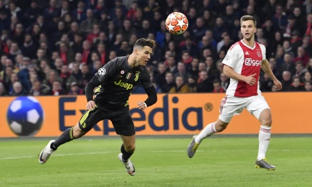 A flying header from Juventus’ Cristiano Ronaldo sends the ball goalwards ... Photograph: Martin Meissner/AP