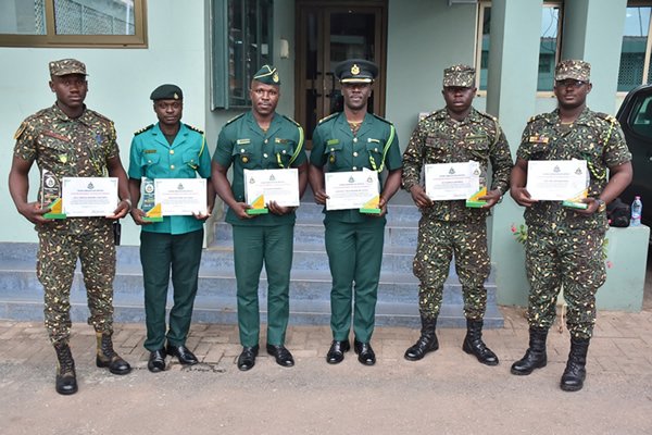 The Officers in a group photograph with the Comptroller-General of Immigration, Kwame Asuah Takyi and his Deputies.