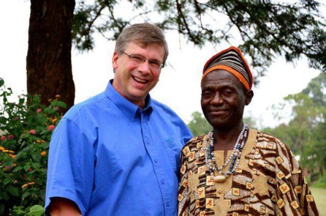 Bible translator Angus Fung (R) poses for a photo with Tearfund Canada President Wayne Johnson (L) in Wum, Cameroon