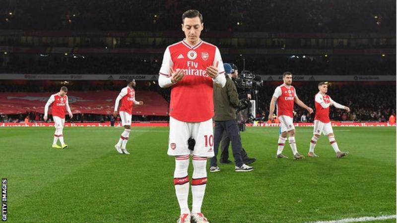Mesut Ozil, who is a Muslim, prays before Arsenal's game against Manchester City on Sunday