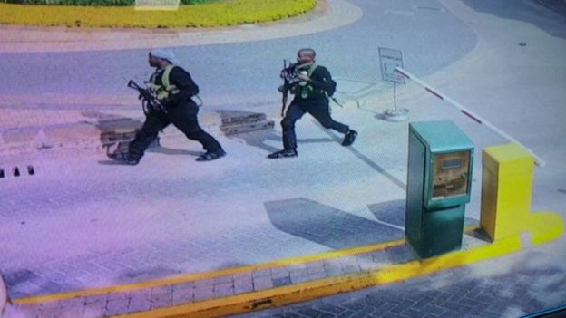 The attackers, two of which are shown here, were caught on CCTV as they entered the complex 