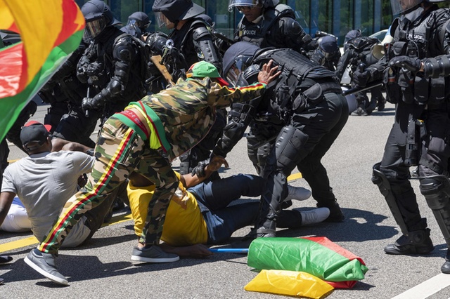 Cameroon protesters clashed with police in Geneva outside the hotel where President Biya was staying.