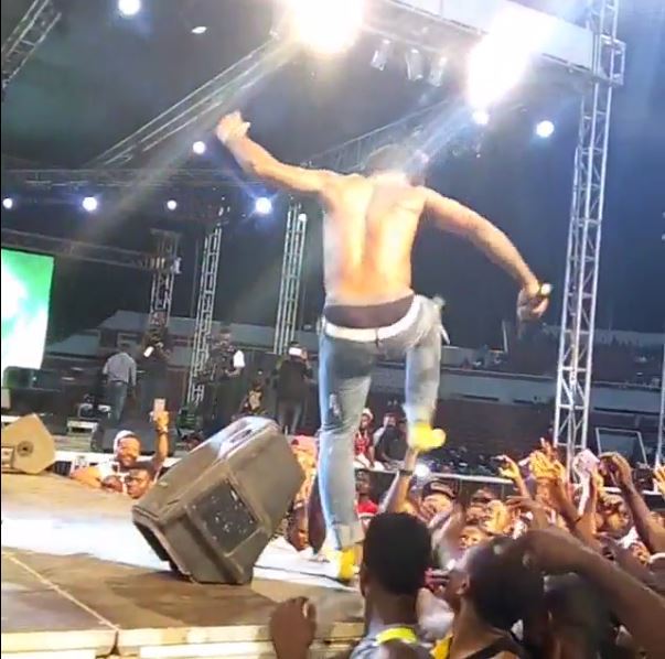 Burna Boy kicks a fan in the head during performance