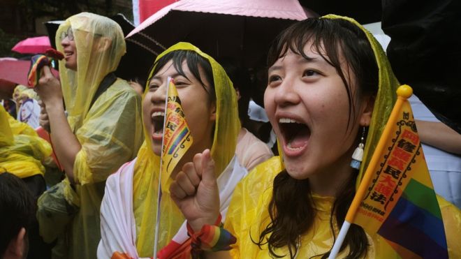 Same-sex marriage supporters stood outside the parliament as the bill was debated