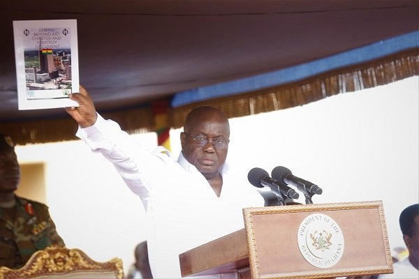 President Akufo-Addo displaying the Ghana Beyond Aid document at the May Day celebrations in Accra