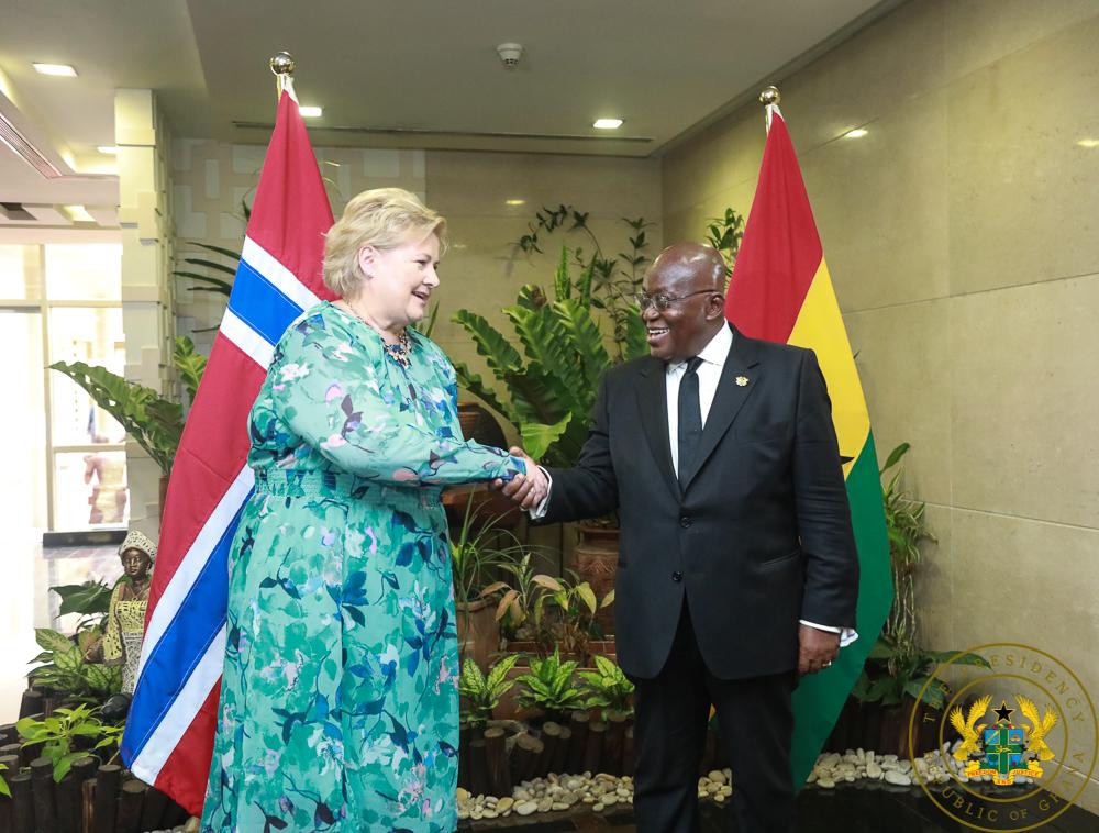 PM Solberg [L] in a handshake with President Akufo-Addo