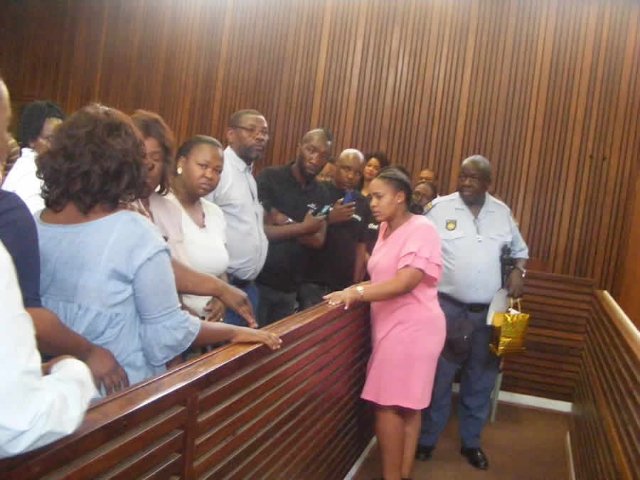 A crying Zinhle Maditla talks to her family members shortly after she was sentenced to four life terms in jail in the Mpumalanga High Court in Middelburg. (Balise Mabona, News24 Correspondent)