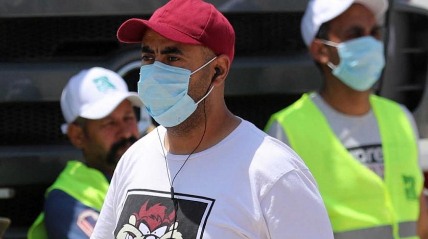 Men wearing protective face masks are seen in downtown Cairo, Egypt, amid concerns about the spread of the coronavirus disease (COVID-19), May 2, 2020. (Reuters)