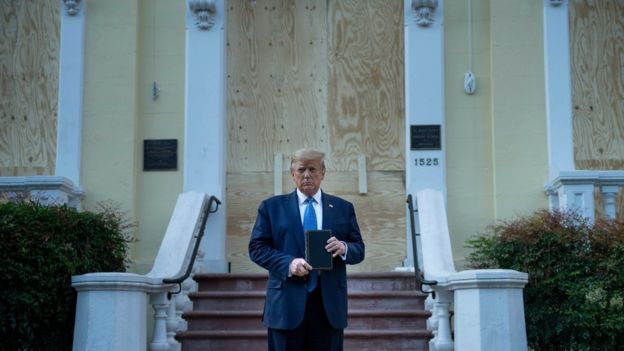 Mr Trump posed in front of a damaged church shortly after police used tear gas to disperse protesters nearby