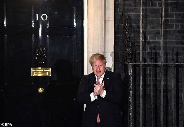 Boris Johnson was outside No10 last night applauding NHS workers who are combating the virus, in a national show of appreciation