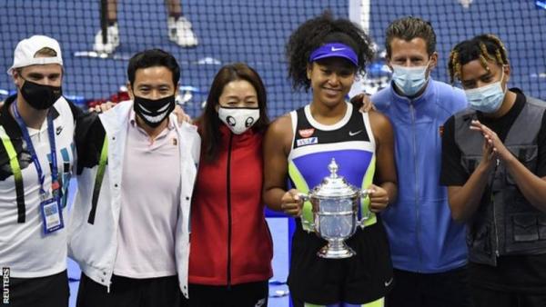 Naomi Osaka celebrated her second US Open win with her team and boyfriend Cordae (on the far right)