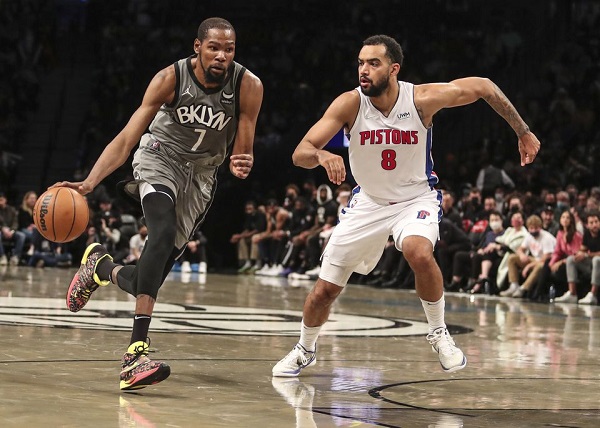 Oct 31, 2021; Brooklyn, New York, USA; Brooklyn Nets forward Kevin Durant (7) drives past Detroit Pistons forward Trey Lyles (8) in the third quarter at Barclays Center. Mandatory Credit: Wendell Cruz-USA TODAY Sports