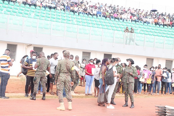 Thousands of youth waiting to be processed for the GIS recruitment
