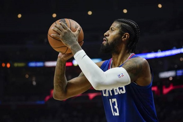 Los Angeles Clippers guard Paul George shoots during the second half of an NBA basketball game against the Portland Trail Blazers.   -  AP
