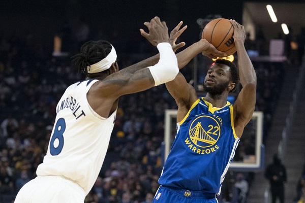 November 10, 2021; San Francisco, California, USA; Golden State Warriors forward Andrew Wiggins (22) shoots the basketball against Minnesota Timberwolves forward Jarred Vanderbilt (8) during the first quarter at Chase Center. Mandatory Credit: Kyle Terada-USA TODAY Sports