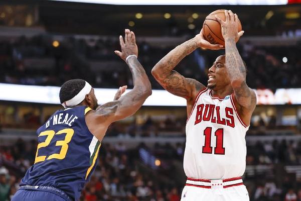 Oct 30, 2021; Chicago, Illinois, USA; Chicago Bulls forward DeMar DeRozan (11) shoots against Utah Jazz forward Eric Paschall (0) during the second half at United Center. Mandatory Credit: Kamil Krzaczynski-USA TODAY Sports