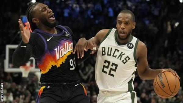 Khris Middleton (right) is a three-time NBA All-Star and won the title with the Bucks last season