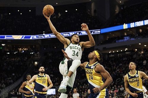 Feb 15, 2022; Milwaukee, Wisconsin, USA; Milwaukee Bucks forward Giannis Antetokounmpo (34) drives for a dunk during the first quarter against the Indiana Pacers at Fiserv Forum. Mandatory Credit: Jeff Hanisch-USA TODAY Sports