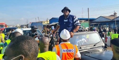 The Greater Accra Regional Minister, Mr Henry Quartey in a blue vest