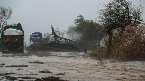 Fierce winds and heavy rainfall flooded highways, disrupting transport services