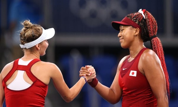 Czech player Marketa Vondrousova shakes hands with Naomi Osaka as the Japanese bowed out of the Tokyo Olympics women’s singles. Photograph: Edgar Su/Reuters