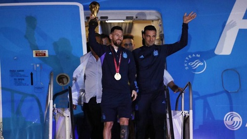 Captain Lionel Messi and coach Lionel Scaloni (right) led the team off the plane