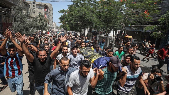 People attend the funeral ceremony of Palestinians, who lost their lives in Israel's attacks, in Rafah, Gaza on August 07, 2022