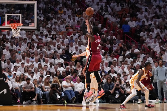 Apr 26, 2022; Miami, Florida, USA; Miami Heat guard Victor Oladipo (4) attempts a three point shot over Atlanta Hawks guard Kevin Huerter (3) during the second half in game five of the first round for the 2022 NBA playoffs at FTX Arena. Mandatory Credit: Jasen Vinlove-USA TODAY Sports