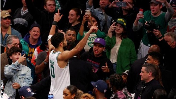 Jayson Tatum celebrates with Boston Celtics fans