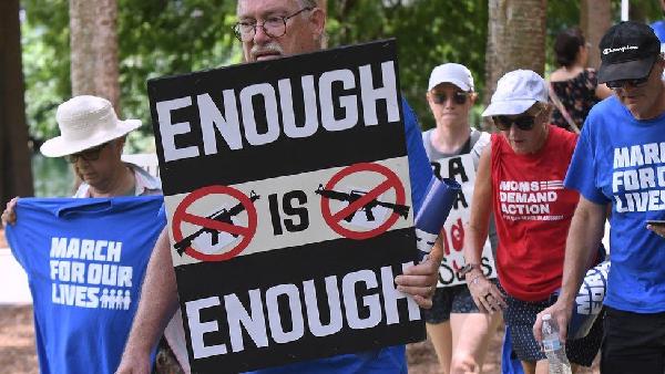 Tens of thousands of protesters rallied across the US on Saturday to call for stricter gun laws