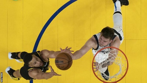 Curry (left) completed a double-double in the first game of the final against the Dallas Mavericks