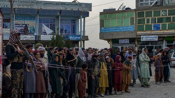 People in the city of Sharan, capital of Paktika province, queue to give blood to earthquake victims being treated in hospital