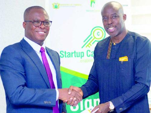 Yaw Owusu-Brempong (left), CEO, Venture Capital Fund exchanging the agreement with Jerry Parkes (right), MD, Injaro at the signing ceremony