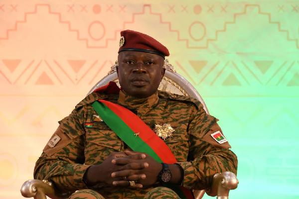 Lieutenant Colonel Paul-Henri Damiba, who led Burkina Faso's military coup in January, sits as he attends his sworn in ceremony for a second time as president to lead a three-year transition after a national conference approved a transitional charter in Ouagadougou, Burkina Faso March 2, 2022. REUTERS/Anne Mimault/File Photo