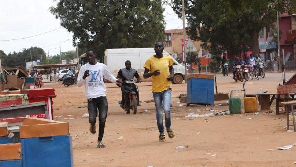 Roads have been blocked and shops closed in the capital, Ouagadougou, as Burkina Faso's power struggle continues