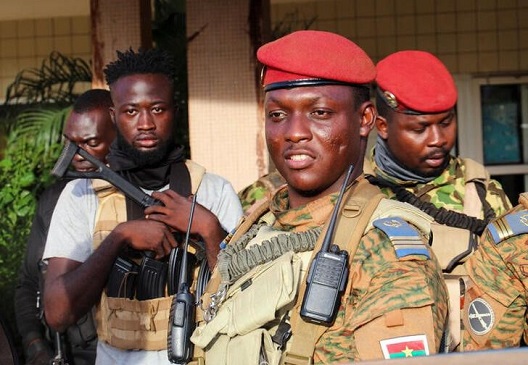 Burkina Faso's new military leader Ibrahim Traore is escorted by soldiers in Ouagadougou, Burkina Faso October 2, 2022. REUTERS/Vincent Bado/File Photo
