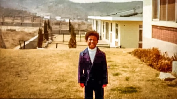Milton Washington pictured at a US military housing complex in South Korea, soon after he was adopted