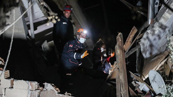 Rescue teams work on a collapsed building in Hatay, Turkey.